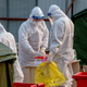 Medical workers are seen at a Covid-19 coronavirus testing site in Beijing on January 23, 2021.